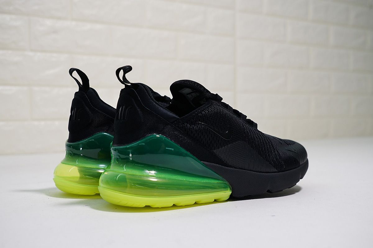 green and black nike sneakers