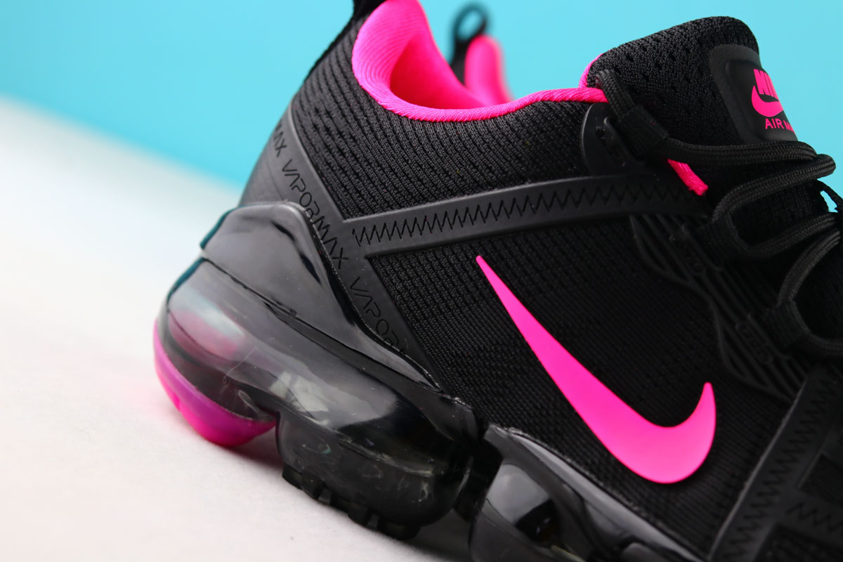 black nike with pink swoosh