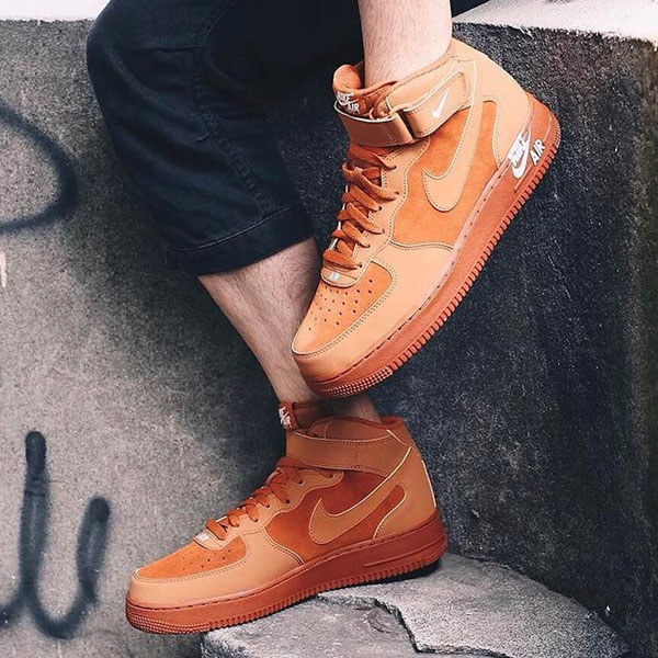 Air Force 1 Mid 07 Orange Midsole Logo on feet