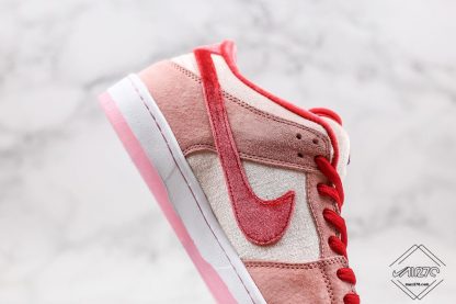 Dunk Low SB x StrangeLove Valentines Day pink swoosh soft pink