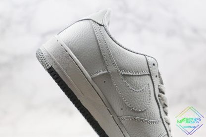 Air Force 1 Low Wolf Grey Obsidian lateral panel swoosh