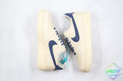 Nike Air Force 1 Low Sail Beige Navy Blue Swoosh