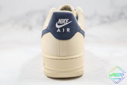 Nike Air Force 1 Low Sail Beige Navy Blue heel