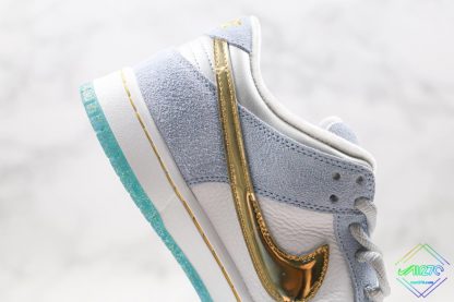 Sean Cliver x Nike SB Dunk Low gold swoosh