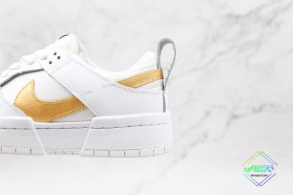 Nike Dunk Low Disrupt Metallic Gold panel swoosh